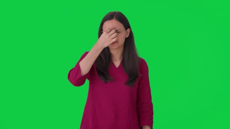 sick indian woman suffering from headache green screen