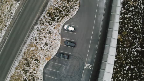 Top-View-Of-A-Luxury-Cars-Positioned-On-Parking-Lot-At-Atlantic-Ocean-Road-In-Norway