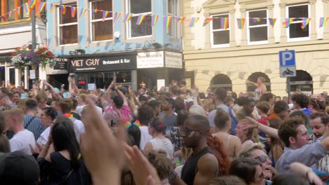 leeds pride lgbtq festival 2019 panning shot of the crowd as they dance and wave their flags long version 4k 25p
