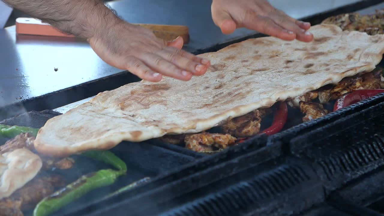 Grilling Meat with Flatbread and Peppers
