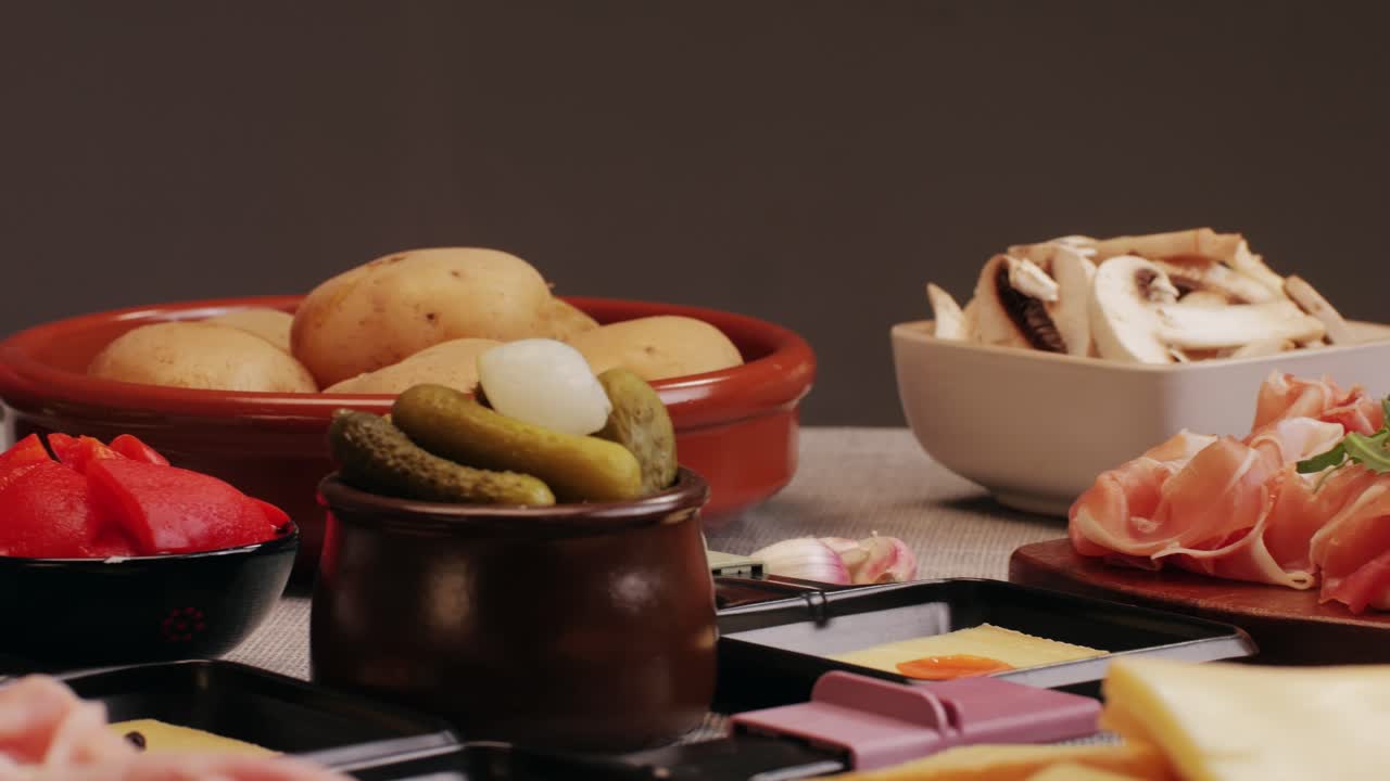 Italian or Spanish restaurant with traditional tapas food, Spanish cuisine, delicious tapas and cheese plate, bruschetta with cheese, olives dry tomatoes and tasty sandwich bar appetizer, buffet