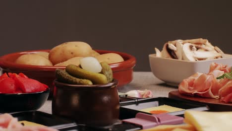 italian or spanish restaurant with traditional tapas food, spanish cuisine, delicious tapas and cheese plate, bruschetta with cheese, olives dry tomatoes and tasty sandwich bar appetizer, buffet