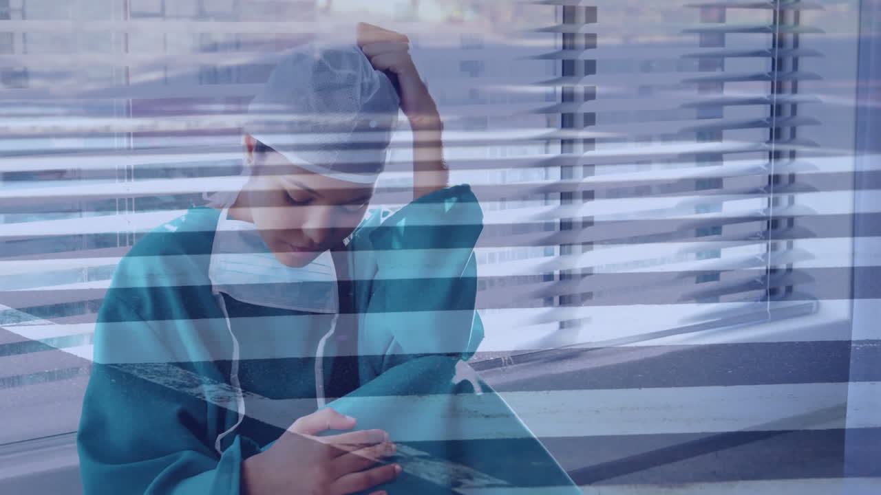 Medical professional in scrubs resting head on hand over horizontal lines animation