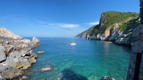 portovenere, a riviera gem overlooking the gulf of la spezia sailboat isolated in rocky bay during a sunny day of summer