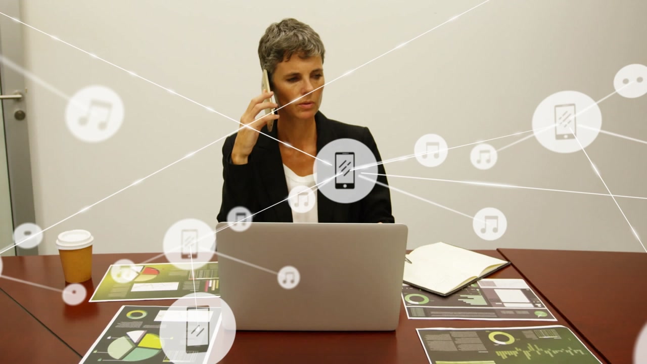 Animation of network of connections over caucasian businesswoman using smartphone and laptop