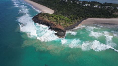 fingal headland in the tasman sea, new south wales, australia - aerial shot