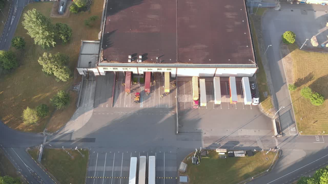 Trailers On The Loading Bay Of A Warehouse In Dublin, Ireland - aerial shot