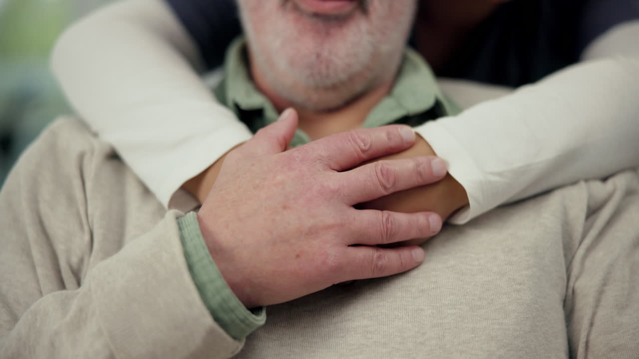 Close up of senior man being hugged