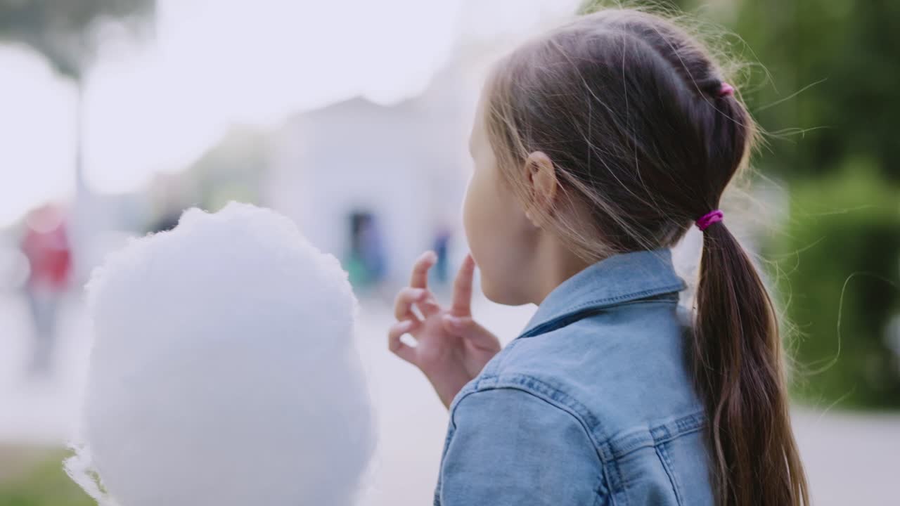 Girl Eating Cotton Candy