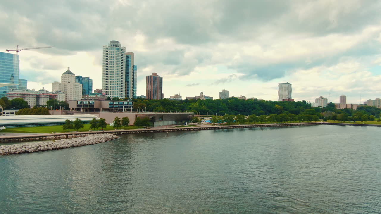 Aerial Establishing Shot of Downtown Milwaukee Skyline with Lake Michigan and a Tour Boat