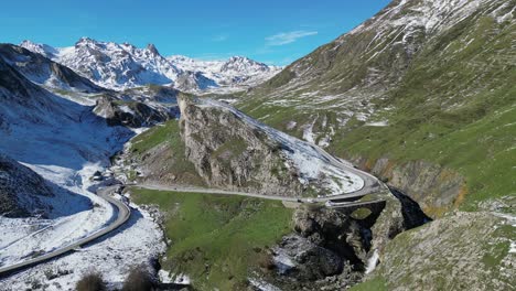 Mountain-Road-in-Snowy-French-Pyrenees,-France---Aerial-4k-Circling