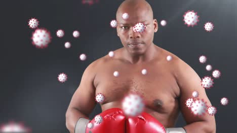 animation of virus cells over african american man boxing