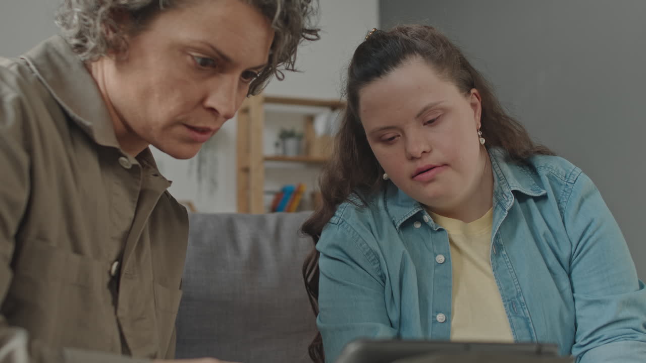 Woman with Down syndrome learning with help