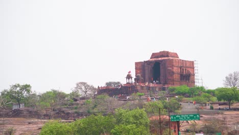 pan shot of an ancient hindu temple building of bhojeshwar on hill top in bhopal of madhya pradesh india