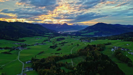 Left-to-right-pan-shot-of-a-patchy-forest-with-visible-mountain-peaks-in-the-distance