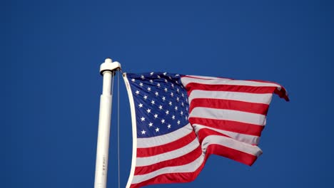 american flag against a background of blue sky