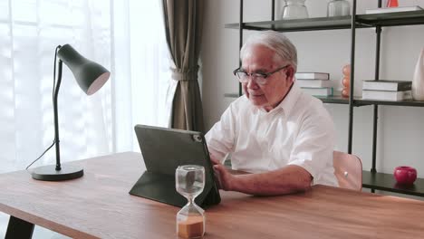 middle-aged male using portable technology