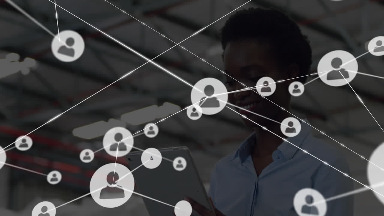 Using tablet, person viewing network of connected user icons in industrial animation