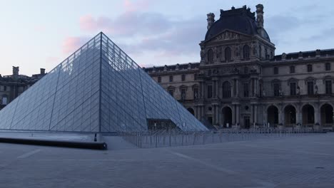 4k louvre pyramid and museum slow truck left wide shot during early morning with nobody