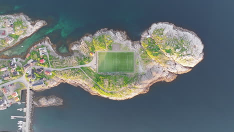 fantastic high altitude aerial view over the famous henningsvaer football field on the lofoten islands during sunset