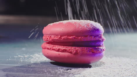 pink macarons with powdered sugar
