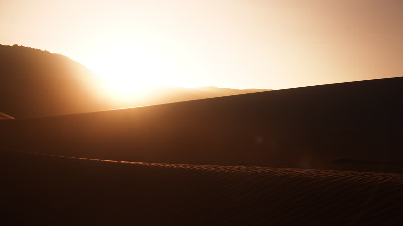 Sunrise over Desert Dunes