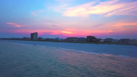 a big pull out of the ocean at sunset, feels tranquil and exciting all at the same time