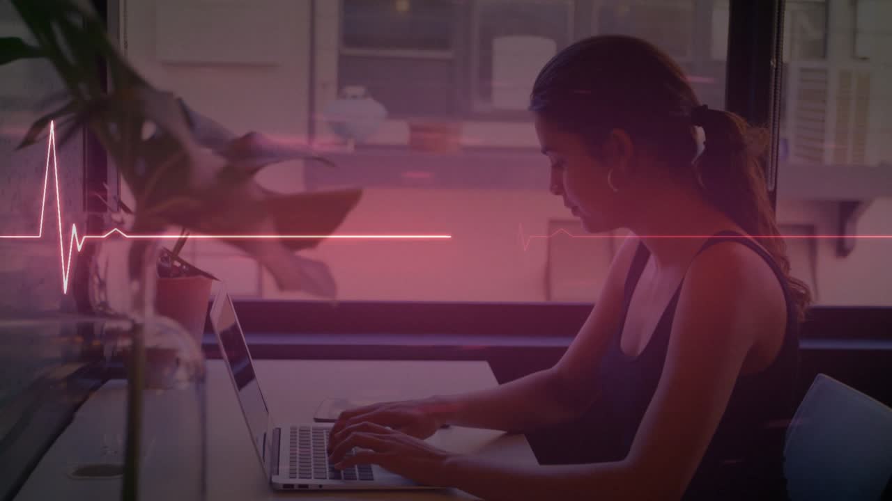 Animation of lifeline over women using laptop