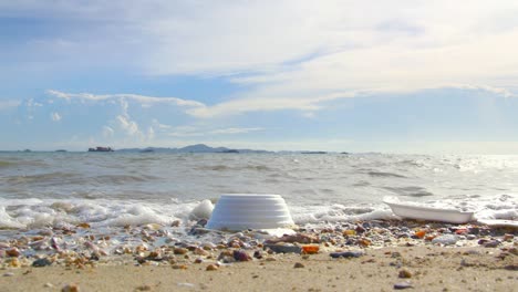 garbage plastic cup on the beach