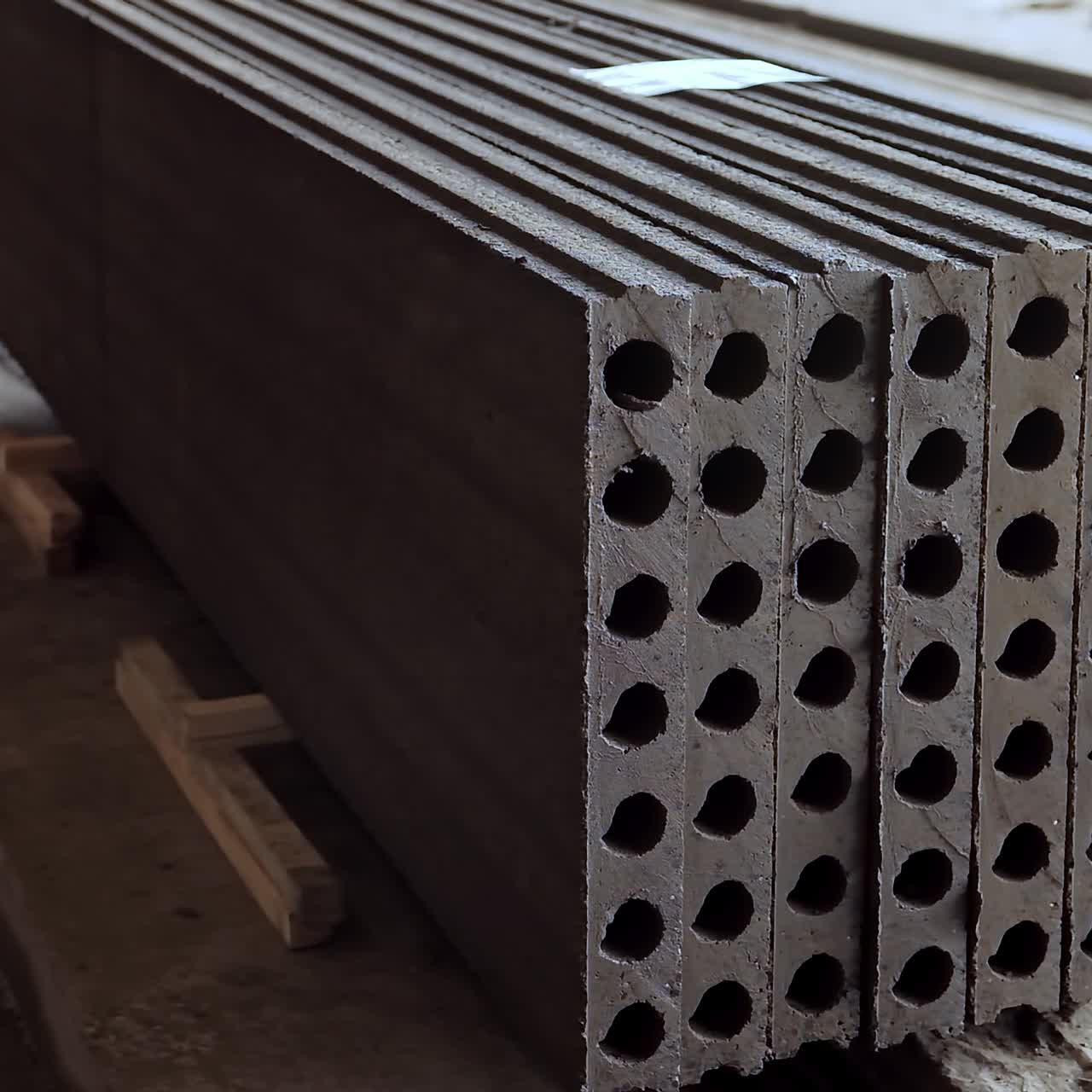 Reinforced concrete slabs stacked together. Plant for the creation of reinforced concrete slabs. Stacks of concrete blocks. Close-up.