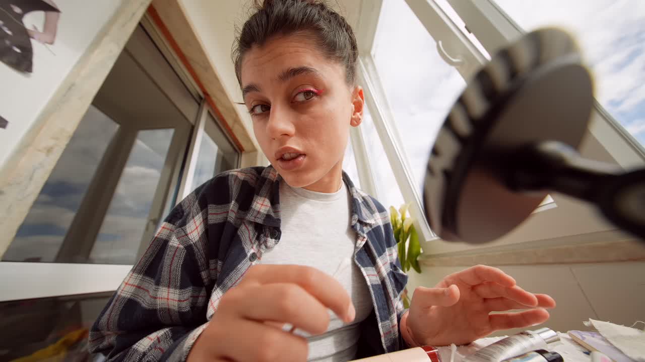 Young Woman Talking and Gesturing During Video Call or Vlogging Session