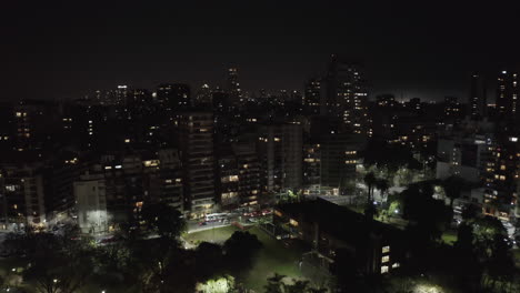 overhead shot de aerial nighttime view of buenos aires cityscape with buildings and park