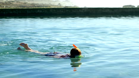 woman swimming in the water at beach 4k