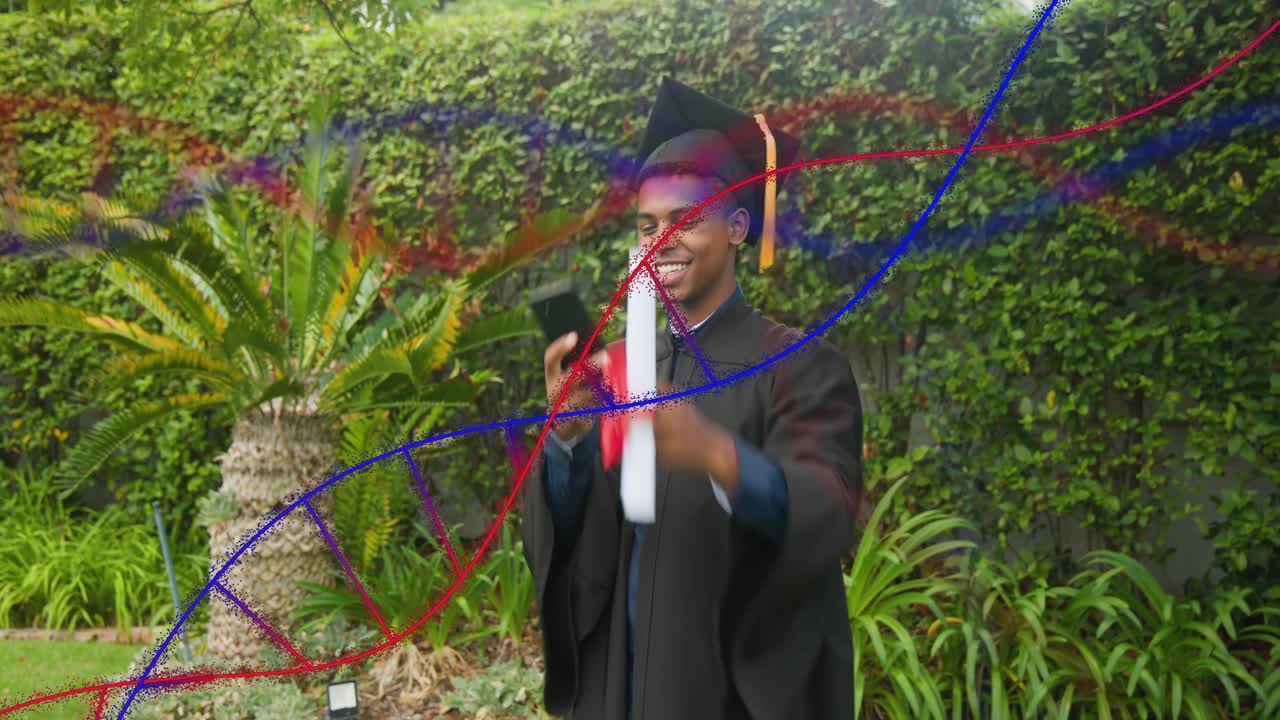 Male grad raising smartphone to frame diploma for grad shot, helix sweeping, partly obscuring him