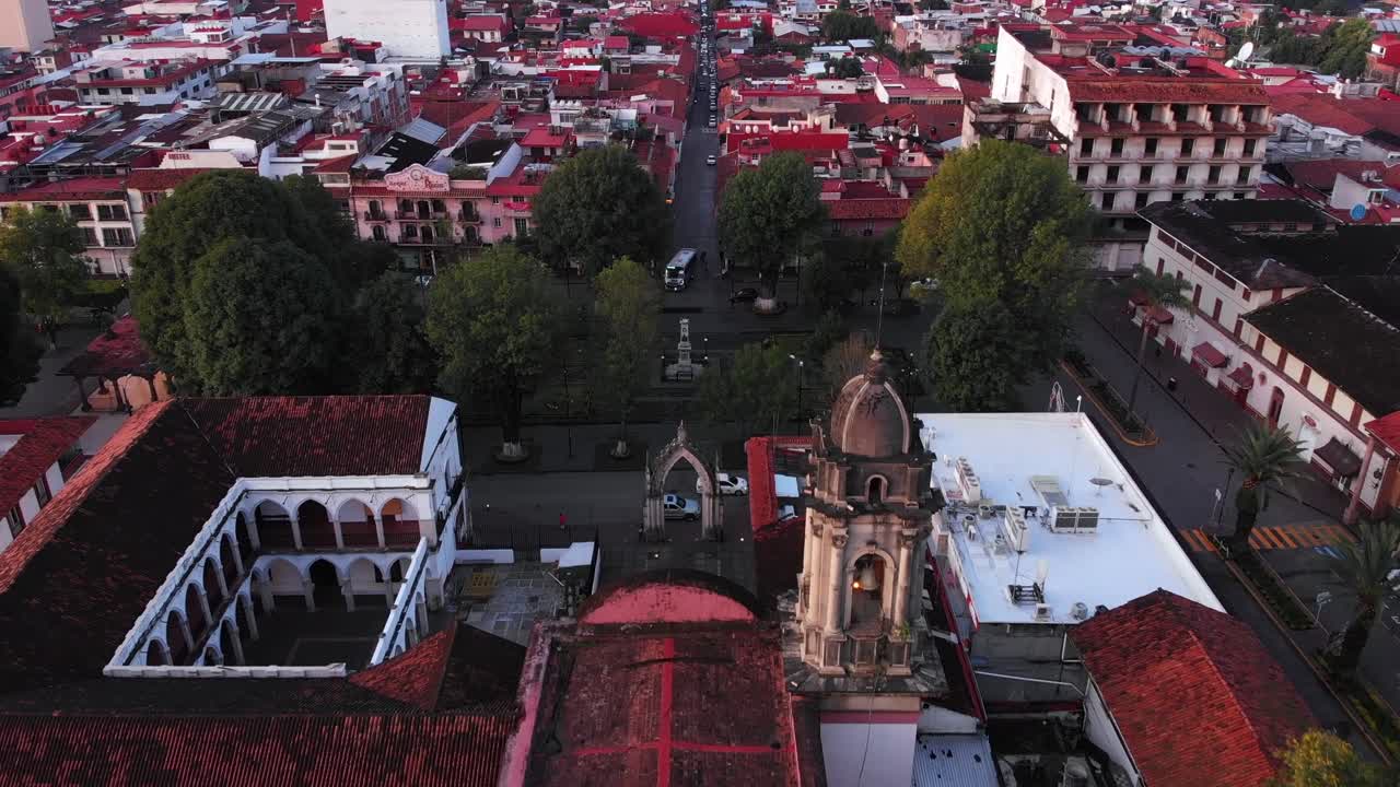 DOLLY IN DRONE SHOT OF SAN FRANCISCO CHURCH IN URUAPAN MICHOACÁN AT SUNRISE