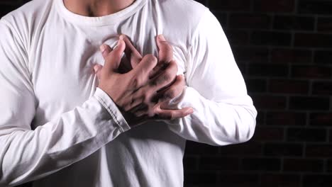 man experiencing chest pain