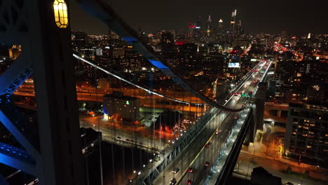 cinematic aerial descending shot of ben franklin bridge in philly