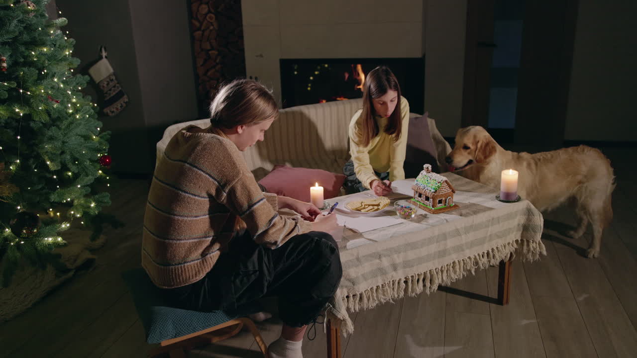Teenagers Making a Gingerbread House by Candlelight