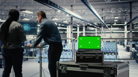 close up of isolated screen laptop in front of data center programmers