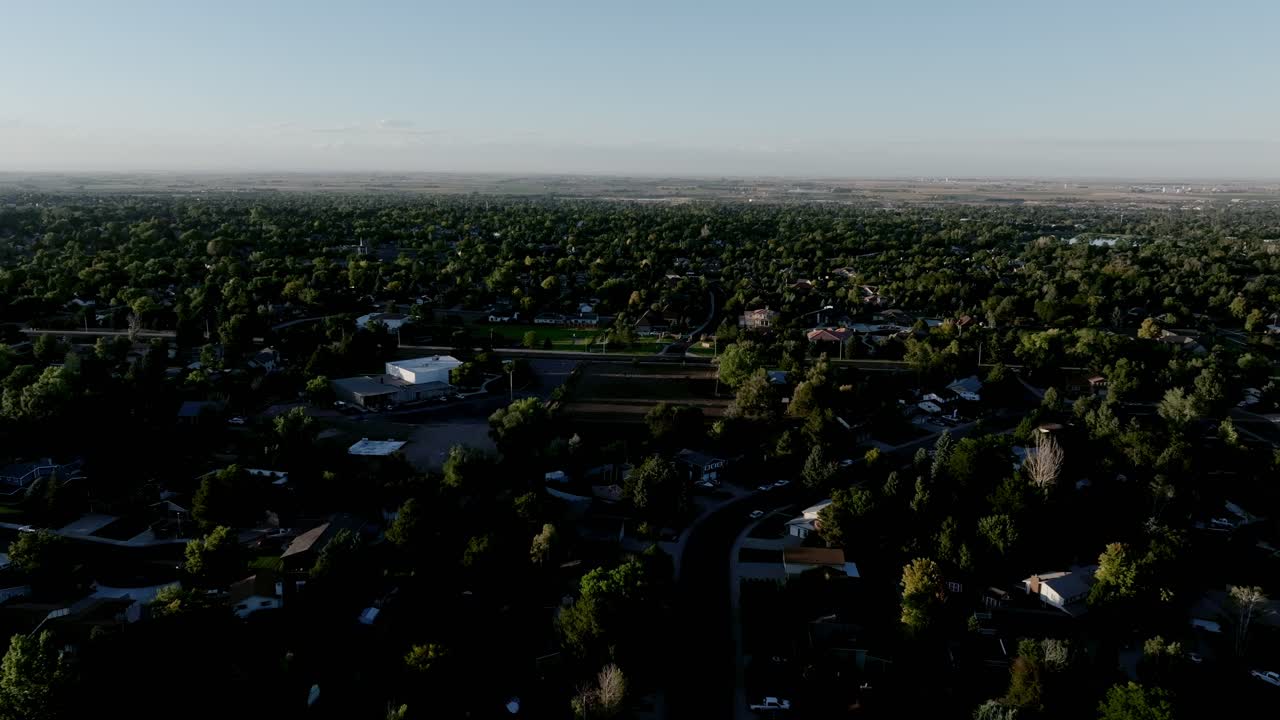 Greeley Colorado late evening golden hour. Long shadows and warm light. Drone flight.