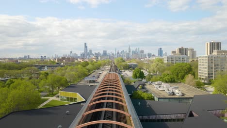 Aerial-View-of-Modern-Subway-Station,-Chicago-Skyline-in-Background