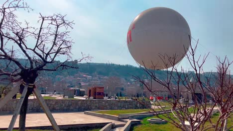 tbilisi, view of a huge balloon rising above the city