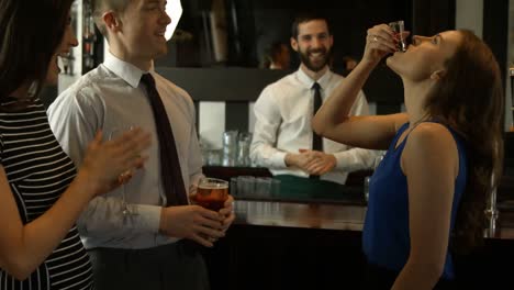 happy friends having a drink together