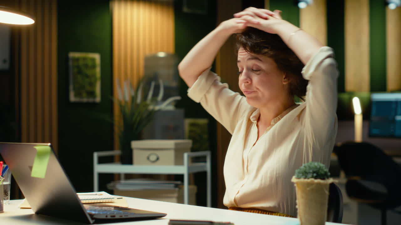 Vertical Video Tensed businesswoman stretching her upper back and neck muscles