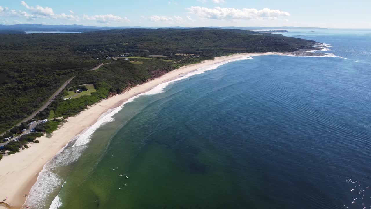 Drone pan scenic nature shot over Catherine Hill Bay ocean waves at beach Swansea NSW Australia 3840x2160 4K