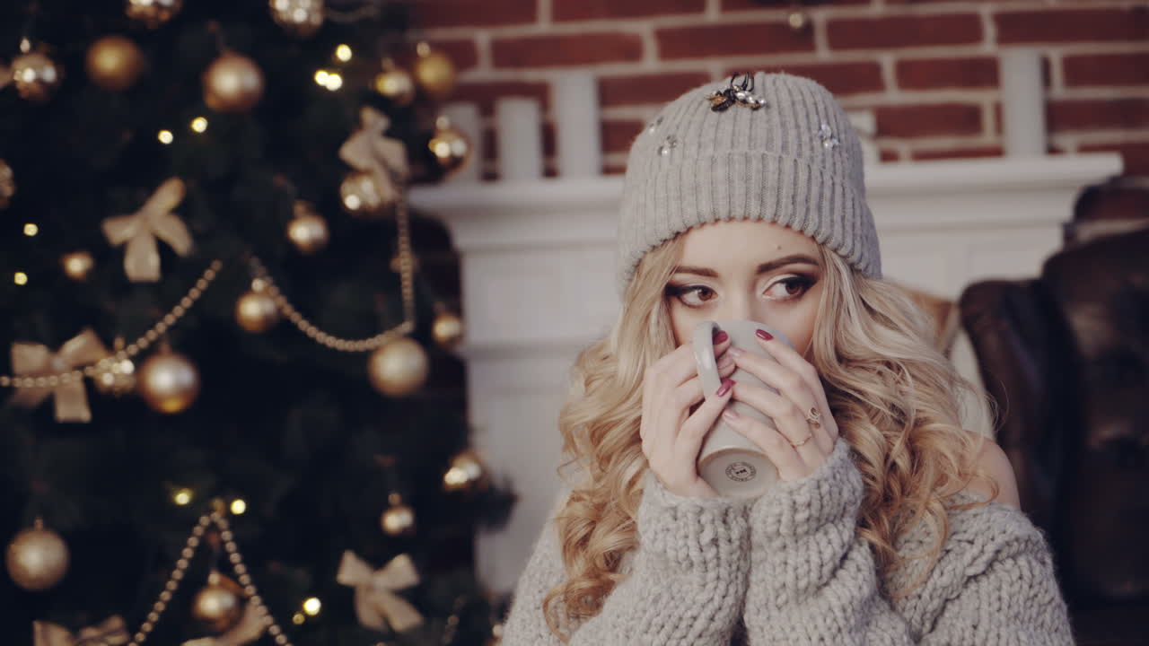 Christmas Holidays atmosphere. Young woman waiting for Christmas miracle in festive atmosphere