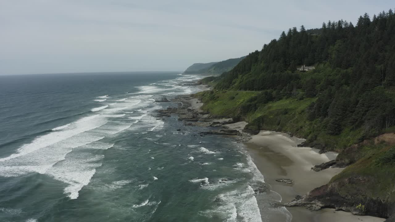 Slowly rising drone shot of rocky Oregon sea cliffs