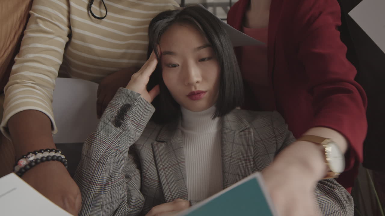 Female CEO Stressed by Paperwork