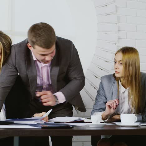 young professionals work with documents and computer