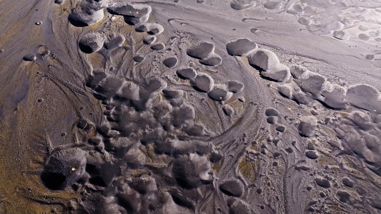 Rugged Basalt Lava Field and Crater Impacts, Iceland Landscape aerial view